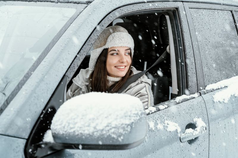 side-view-smiley-woman-driving-car-road-trip.jpg